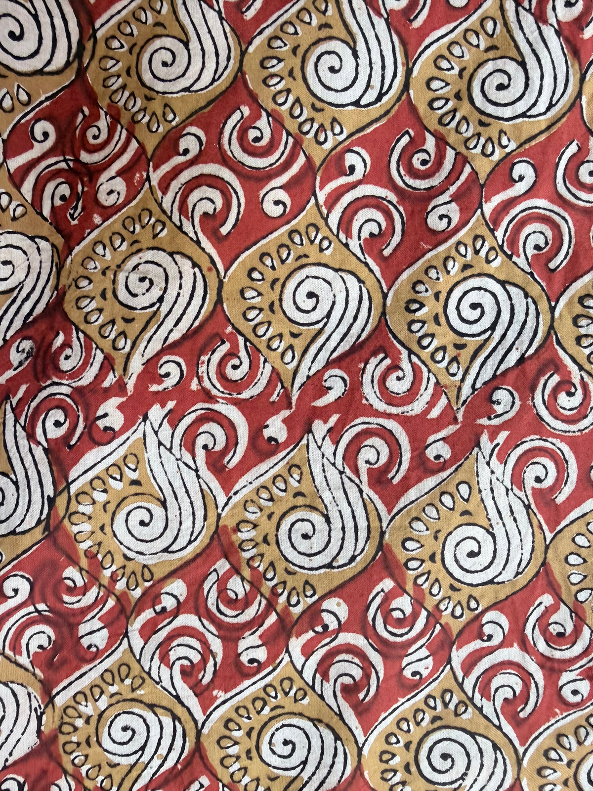 Relaxed Overalls, Gold Waves and Wind on
Red, fabric closeup
